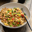 Breakfast fried rice with bacon and scrambled eggs