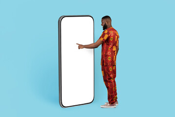 Great App. African Man In Traditional Costume Touching White Big Smartphone Screen