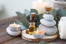 Assortment Of Natural Oils In Glass Bottles On Wooden Background. Concept Of Pure Organic Ingredients In Cosmetology. Bath Accessories, Atmosphere Of Harmony, Relax. Close Up Macro. Healthy Lifestyle