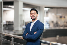 Smiling Confident Calm Attractive Young Middle Eastern Businessman With Beard In Suit With Crossed Arms