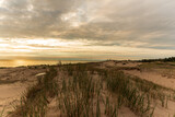 Fototapeta  - Grassy sand dunes and Lake Michigan at Sunset