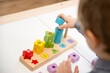 Learning counting, shapes and colors. Montessori type implement. Wooden toys for education. Fine motor skills, therapeutic task for brain exercises and mental development Logic training game. 