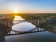Beautiful View Of The Arched Railway Bridge Across The Iset River In The City Of Kamenkk-Uralsky At Sunset In Spring. Kamensk-Uralskiy, Sverdlovsk Region, Ural Mountains, Russia.
