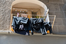 Laundry Hung Out To Dry In Front Of The Window On The Wall Of The House