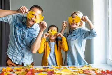 Happy family doing autumn decor. Fall atmosphere