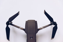 New Modern Drone On Display On White Background. Drone Quadcopter With Digital Camera.