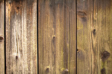 Beautiful Pattern Of Vertical Wooden Boards. Medium Brown Glazed And Weathered Wood With Knotholes As A Background With Many Possible Uses