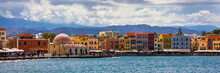 Mosque In The Old Venetian Harbor Of Chania Town On Crete Island, Greece. Old Mosque In Chania. Janissaries Or Kioutsouk Hassan Mosque In Chania Crete. Turkish Mosque In Chania Bay. Crete, Greece.