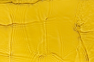 Poster - Waves on clear water surface, yellow abstract background.