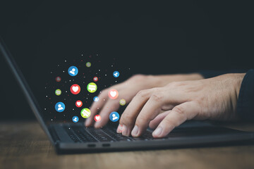 Wall Mural - technology concept social media man using computer access online media Through the Internet, there is marketing to answer customer chats. by working at home