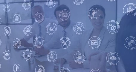 Poster - Multiple digital icons against group of diverse office colleagues in meeting room at office
