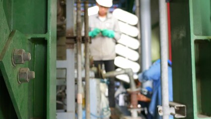 Wall Mural - Industrial Worker in oil refinery plant, wearing personal protection equipment and working in production plant 