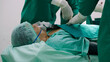 © comzeal - Asian senior man undergoing heart surgery in the operating room