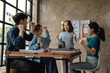 © aksonsat - Shot of colleagues celebrating during a meeting in a modern office