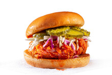 Spicy Country Fried Chicken Sandwich On A Brioche Bun With Pickles And Coleslaw; White Background; Copy Space