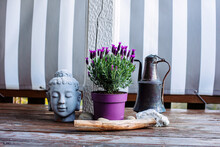Lavender, Buddha Head And Old Copper Jug On Wooden Terrace