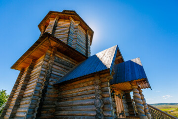 Poster - Old Slavic tower of the Sun in the old village. Wooden religious pagan tower for prayers. Russian village.