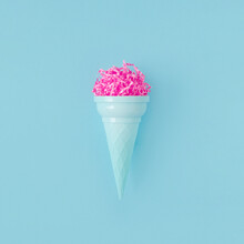 Pink Paper Ice Cream Scoop With Ice Cream Plastic Cone On Bright Blue Background. Minimal Summer Concept. Micro Plastic In Food. Recycling.