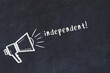 © iushakovsky - Chalk loudspeaker and inscription independent on black chalkboard