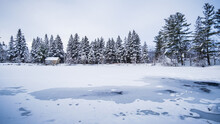 Frozen Pond In The Countryside Near Tremblant Ski Resort On A Cold And Snowy Winter Day In Quebec (Canada)
