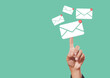 © eakgrungenerd - Sending email contact network concept. Hands finger touch pointing email contact icons green background, communication message send and receive.