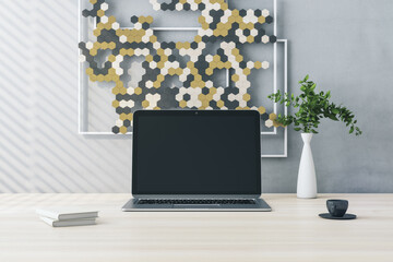 Poster - Close up of creative wooden designer desktop with empty computer screen and decorative banner, plant and coffee cup. Mock up and 3D Rendering concept.