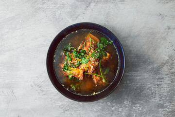 healthy plant-based food, vegan wonton dumpling soup with spicy broth