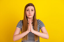 Photo Of Young Woman Hands Together Ask Beg Pray Wish Luck Wait Isolated Over Yellow Color Background