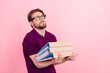 © Tetiana - Profile side photo of young man hold paper folder look empty space eyewear isolated over pink color background