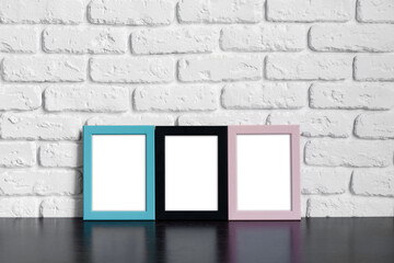 Wall Mural - Photo frame with copy space against white brick wall