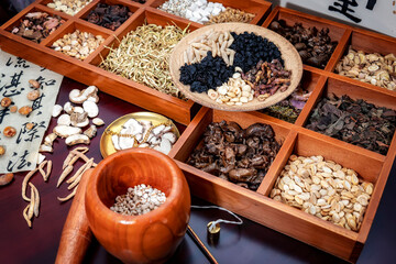 Chinese herbal medicine and flower tea on wooden