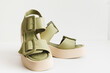 Leather women's platform sandals in olive color, top view isolate