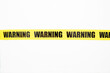 © EdNurg - Yellow warning tape isolated and cutout on white background. Risk and accident concept