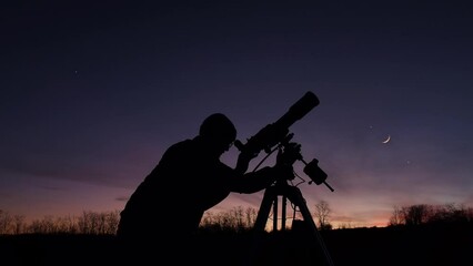 Wall Mural - silhouette of a man, telescope, stars, planets and shooting star under the night sky.