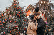 © Ananass - Winter holidays and people concept - happy family with little daughter choosing Xmas tree at Christmas tree fair. Happy preparation for the celebration of New Year holidays