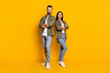 © deagreez - Full body photo of young confident man woman folded hands team colleagues isolated over yellow color background
