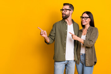 Sticker - Photo of impressed millennial brunette people index look promo wear glasses shirt isolated on yellow color background