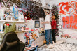 © Drobot Dean - Two multiracial teenagers drawing on wall with markers in bedroom