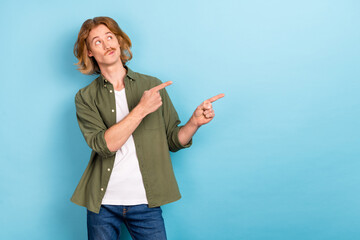 Poster - Portrait of attractive funky skeptic guy demonstrating copy blank space deciding isolated over pastel blue color background