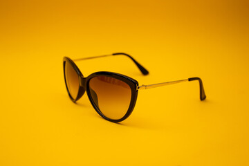 Poster - Black s sunglasses on orange background