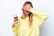 Young Uruguayan woman holding Frappuccino isolated on white background covering eyes by hands. Do not want to see something