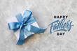 Design concept top view of Father's day gift idea with greeting on gray concrete background. 