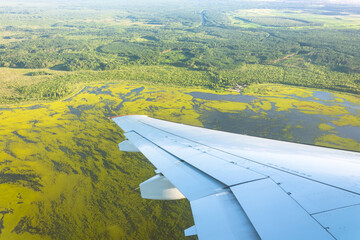 Wall Mural - View from window of airplane to forests, fields, lakes, swamps