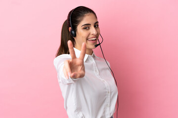 Poster - Young telemarketer over isolated background smiling and showing victory sign