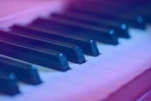 Keys Classic Piano Keyboard In Pink And Blue Neon Lights Colors.