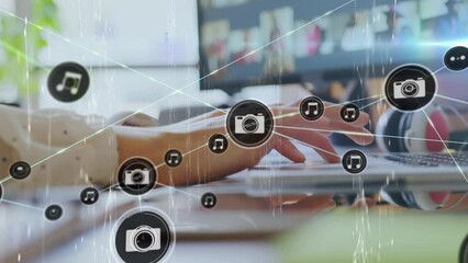 Poster - Animation of network of connections with icons over caucasian businesswoman using laptop