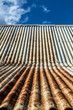© Austockphoto - Rusty corrugated iron roof texture.