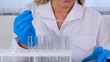 © Евгения Медведева - professional scientist laboratory assistant takes and examines samples using a micropipette and test tubes to work under a microscope in a laboratory, close up.