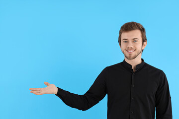 Wall Mural - Concept of people, young man on blue background