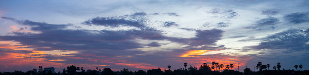 Wall Mural - Dark dramatic sky with thick clouds after sunset